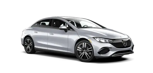 Silver Mercedes-Benz four-door sedan shown in a front three-quarter view on a black background, featuring sleek LED headlights, a sculpted grille, aerodynamic body lines, alloy wheels, and modern luxury styling.