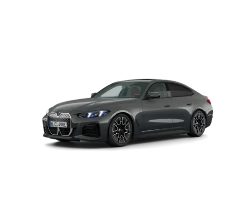 Gray luxury sport sedan shown in a front three-quarter view, featuring a large black grille, sharp LED headlights, sculpted bodywork, dark alloy wheels, and a sleek fastback-style roofline against a black background.